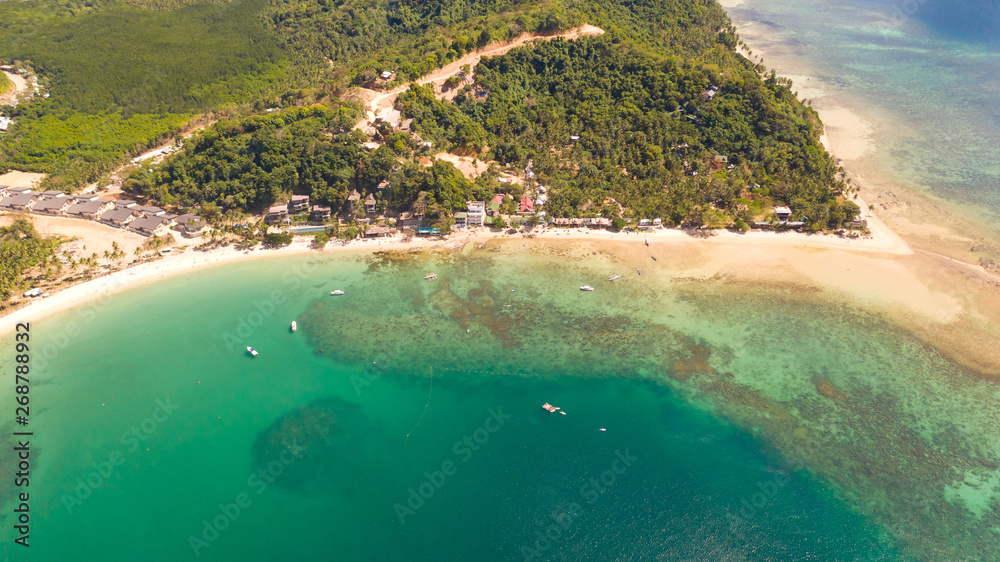Las Cabanas Beach. Islands and beaches of El Nido.Tropical islands with white sandy beaches, aerial view.