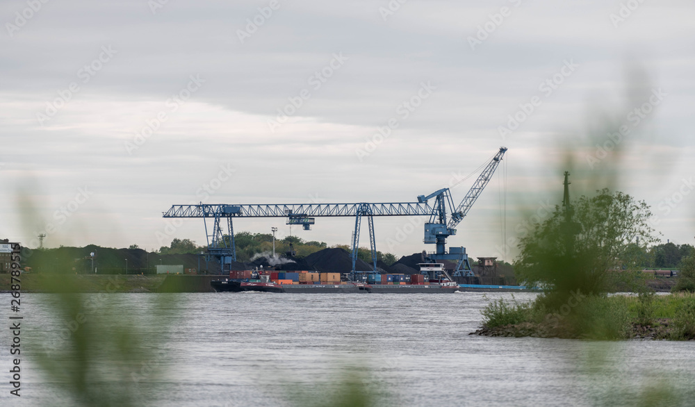NRW/GERMANY - MAY 16, 2019: A containership drives down the river rhine in Duisburg, Germany. 