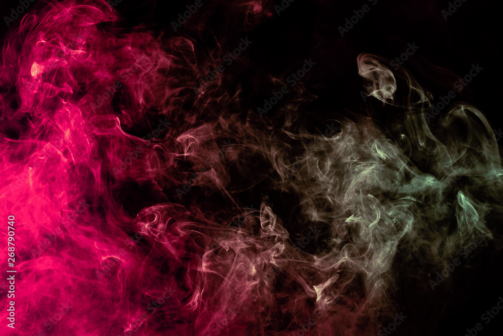 Beautiful column of smoke in the neon bright light of red, green, pink and turquoise on a black background exhaled out of the vape. Nice pattern for printing and backdrop of colored waves. Beautiful column of smoke in the neon bright light of red, green, pink and turquoise on a black background exhaled out of the vape. Nice pattern for printing and backdrop of colored waves.