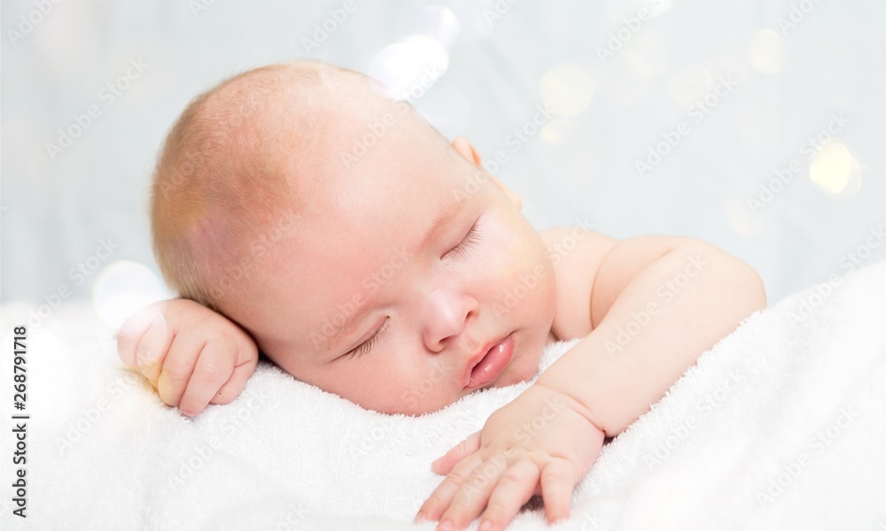 Newborn Baby Boy Sleeping Peacefully on Blue Blanket Newborn Baby Boy Sleeping Peacefully on Blue Blanket