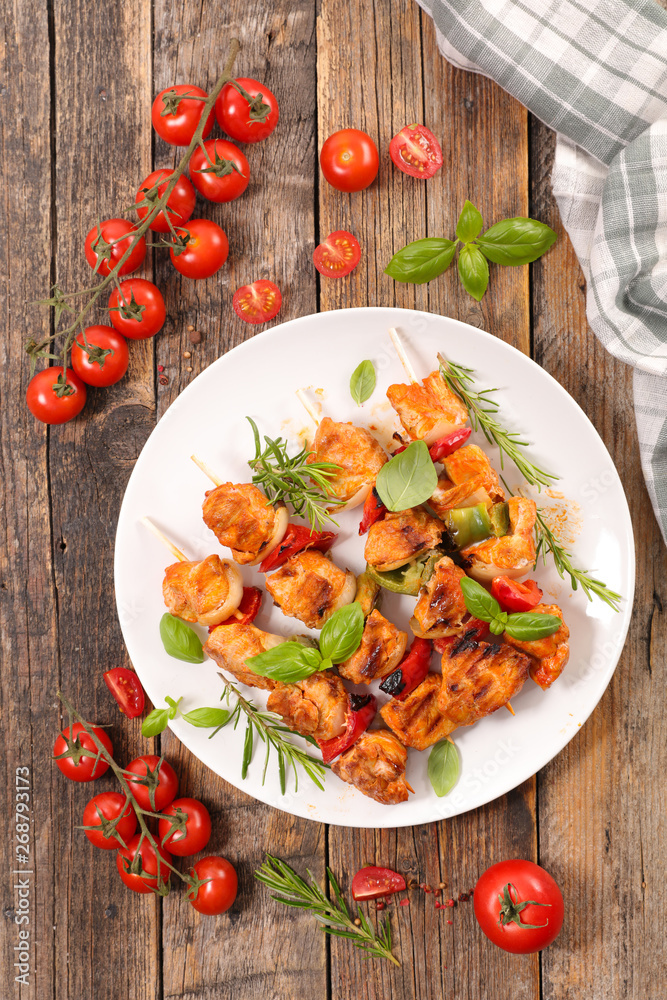 fried chicken barbecue with tomato and herbs