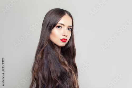 Cute brunette woman with long healthy hairstyle