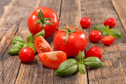 tomato and basil on wood background