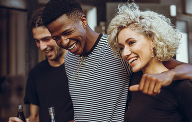 Cheerful young friends hangout out in the city