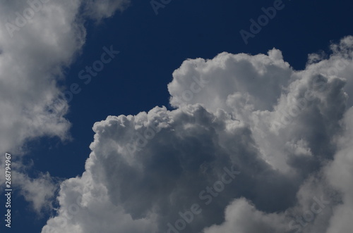 blue sky with beautiful white fluffy clouds