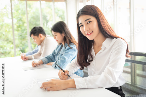 woman working with a group of young business people