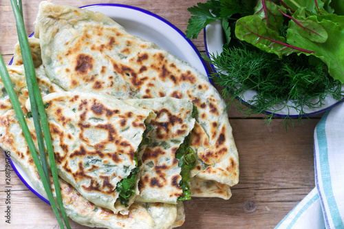 Obraz na płótnie Baker making traditional dish of Armenians from Artsakh Zhingyalov hats is a type of flatbread stuffed with herbs. w salonie