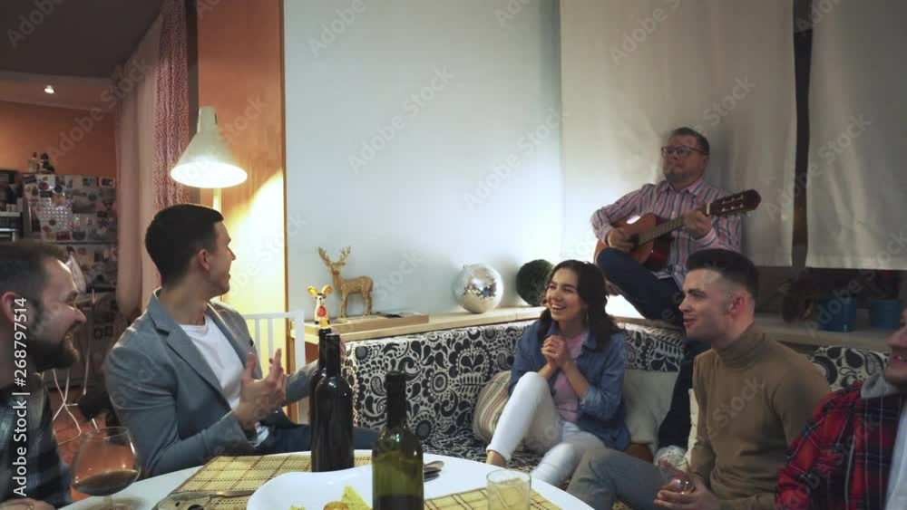 company of friends singing songs at a party company of friends singing songs at a party