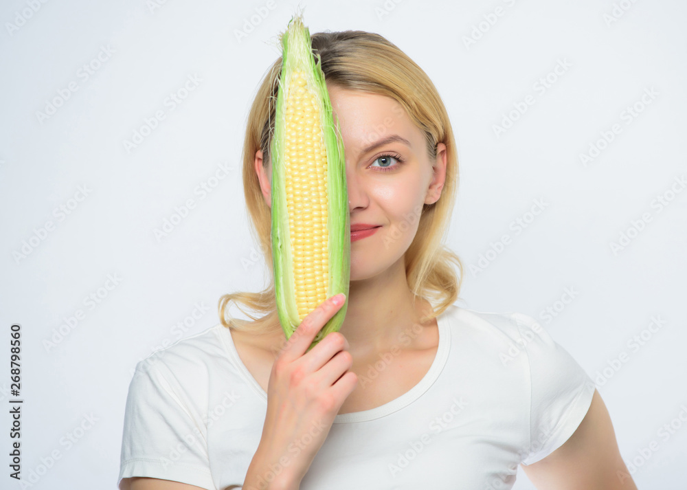 Food vegetarian and healthy natural organic products. Vegetarian menu. Eat corn benefits. Healthy food concept. Woman hold yellow corn cob white background. Corn harvest. Girl hold ripe corn Food vegetarian and healthy natural organic products. Vegetarian menu. Eat corn benefits. Healthy food concept. Woman hold yellow corn cob white background. Corn harvest. Girl hold ripe corn