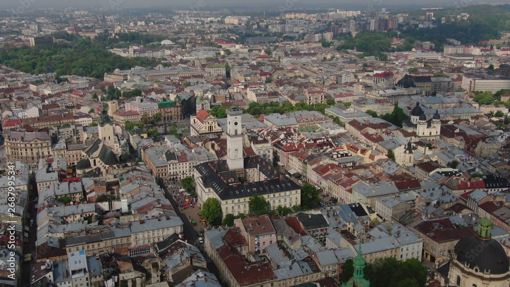 Aerial Roofs and streets Old City Lviv, Ukraine. Panorama of the ancient town. City Council, Town Hall, Ratush, old church Lviv Latin Cathedral