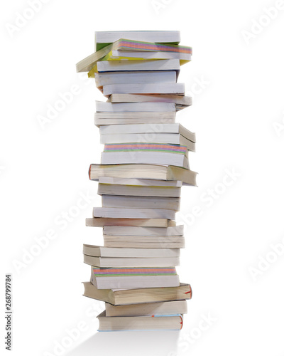 Education and reading concept. Stack of books isolated on white background, backlight.