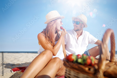 Two young people on beach and summer time 