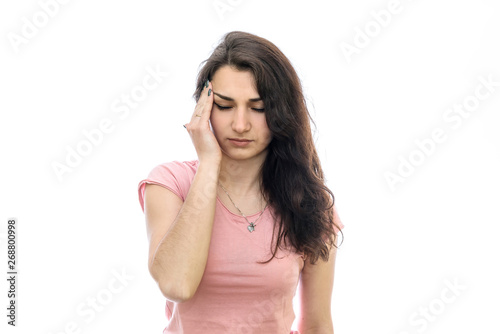 Young woman with headache isolated on white