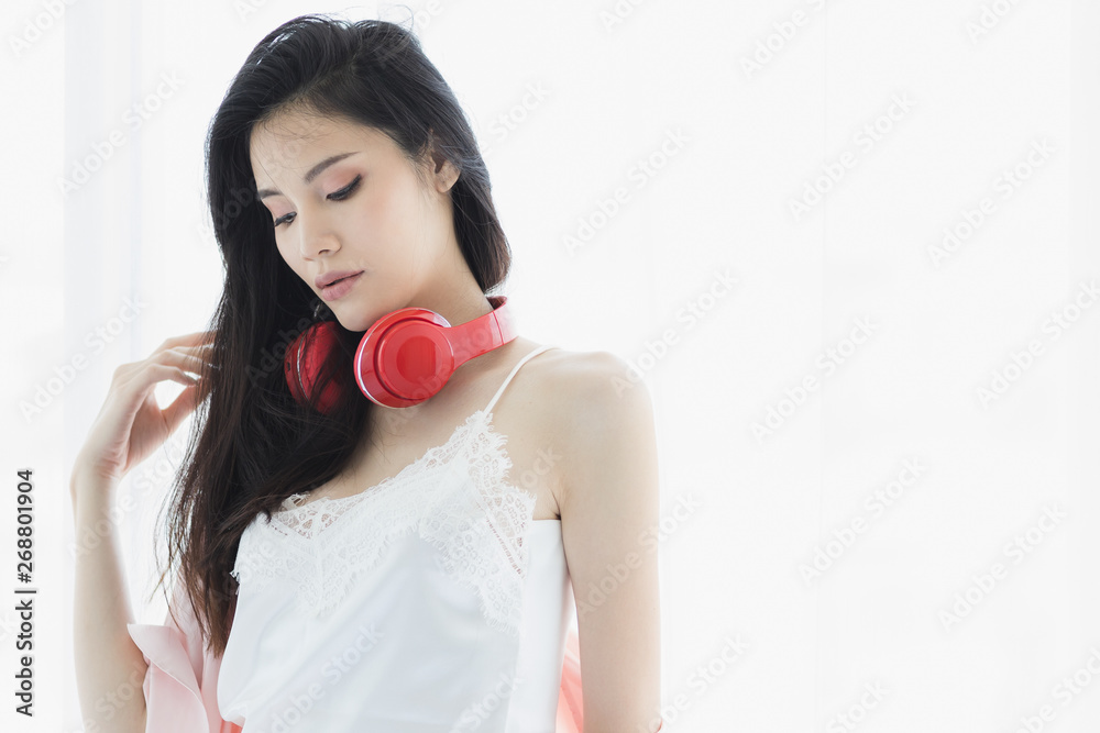 Asian black hair woman wearing red headphone.. Asian black hair woman wearing red headphone..