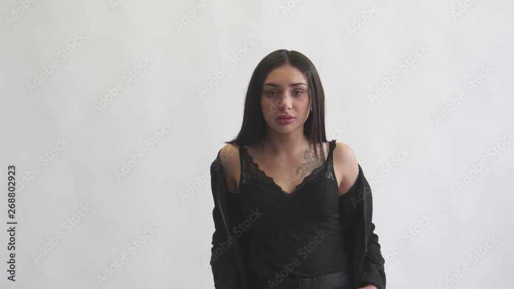 girl model looks on white background shows clothes close-up face girl model looks on white background shows clothes close-up face