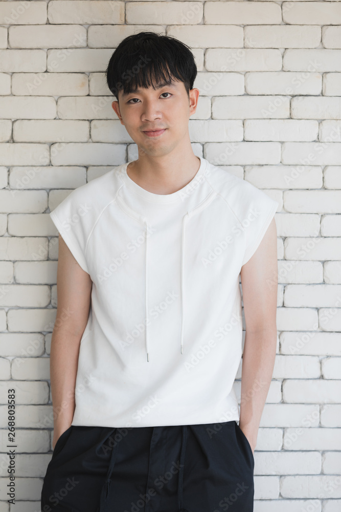 Sexy Asian model man standing and posing.. Sexy Asian model man standing and posing..
