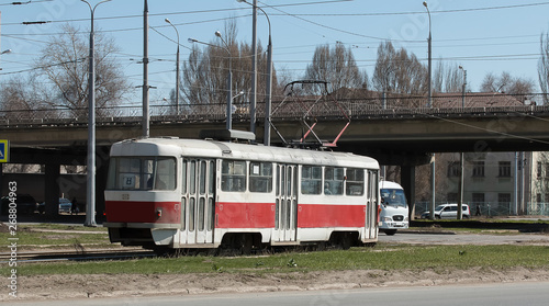 the old-style tram moves through the city