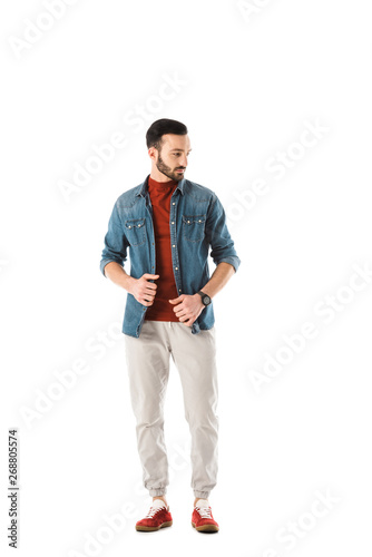 handsome bearded man in denim shirt looking away isolated on white