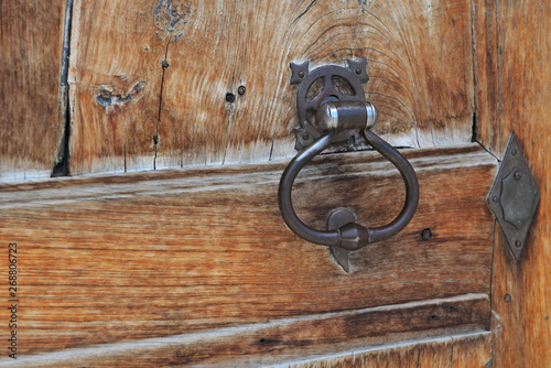 close on metal knock on an old wooden door
