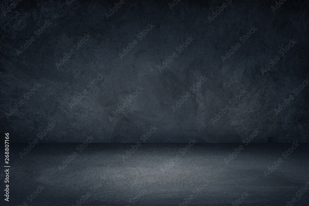 Dark black and blue grungy wall background for display or montage of product