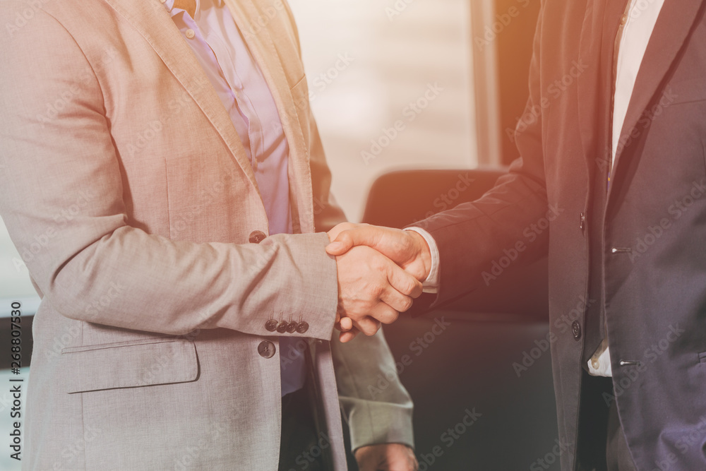 Fototapeta premium two businessman handshake for working successful job done or dealing contract in office.