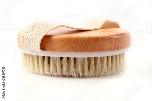 brush for dry massage on a white background isolated.