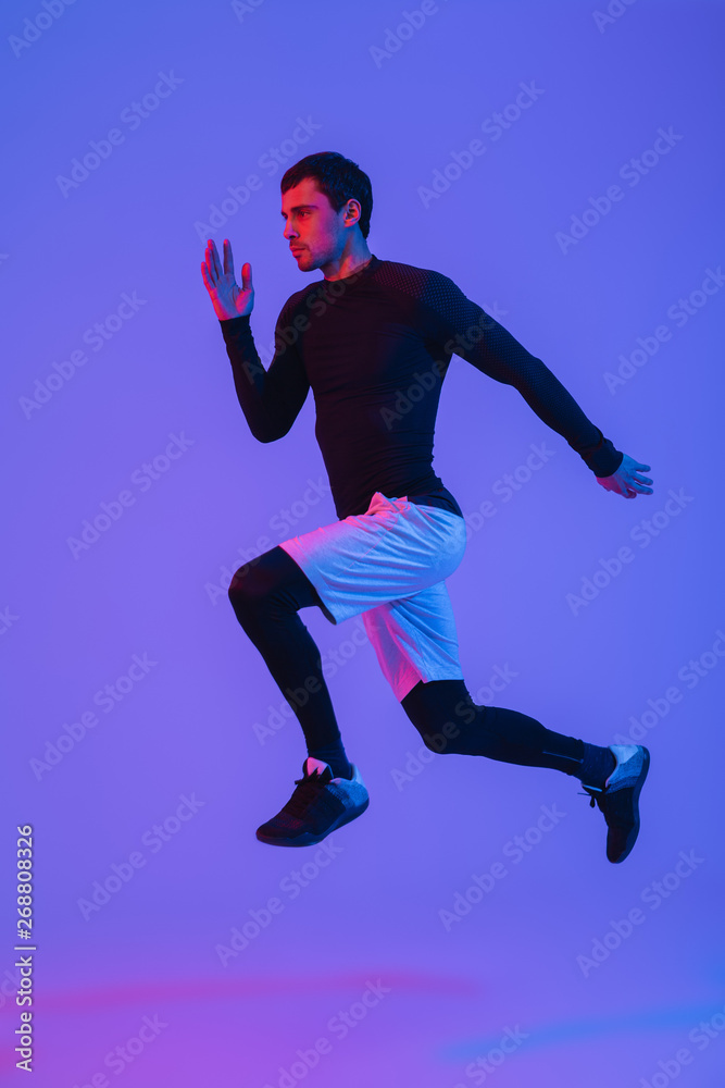 Full length portrait of a fit sportsman running isolated Full length portrait of a fit sportsman running isolated