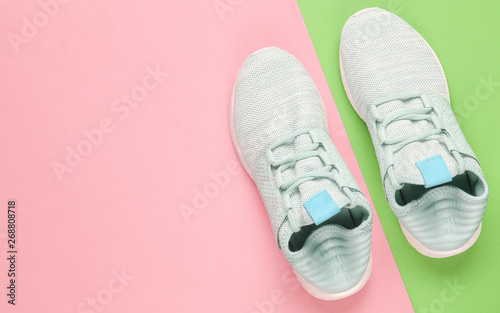 Sneakers. Sports shoes on a creative color paper background. Overhead shot of running shoes.Top view