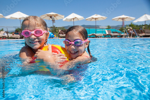 Children swim in  pool © yanlev