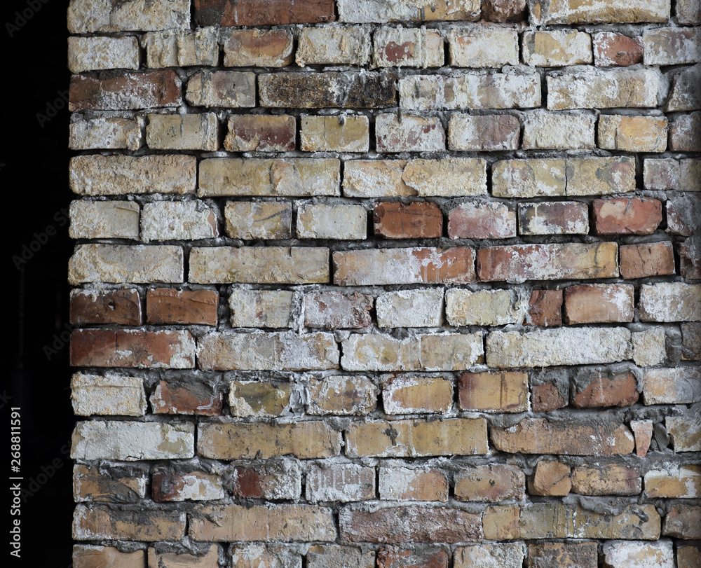 Obraz premium old weathered flaky brick wall