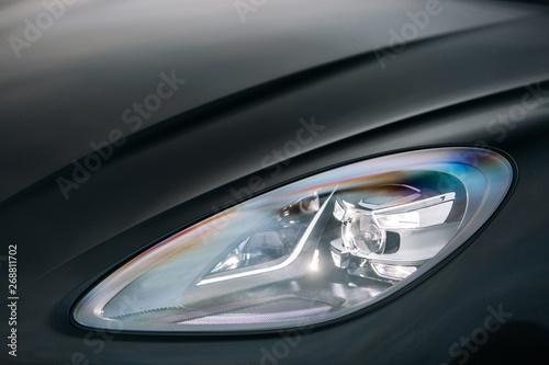 Headlight of modern luxury supercar. Close up detail shot © Moose