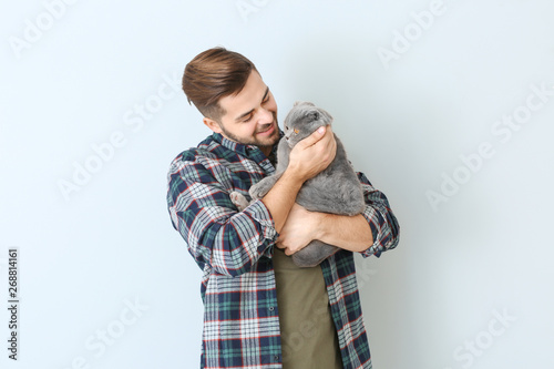 Young man with cute funny c...