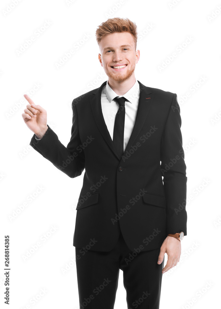 Portrait of businessman pointing at something on white background Portrait of businessman pointing at something on white background