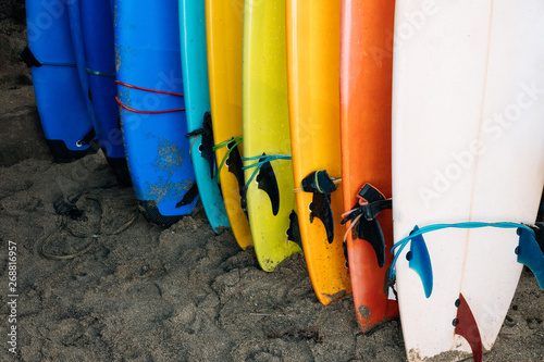 Canvas Print Lot of single fin surfing longboard with surf leash ready for rent