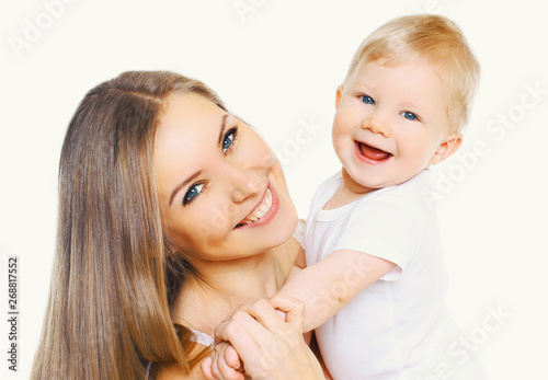 Portrait close-up happy smiling mother and baby having fun together isolated on white background