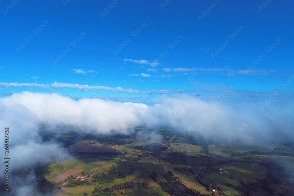 Flying above clouds with a blue sky. Freedom, Inspiration, Peace, Abstract. Great landscape.