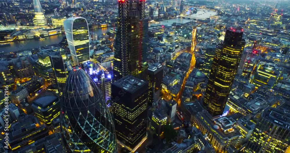 London, England; Skyline aerial drone footage with views of the Gherkin and the city of London at sunset. 