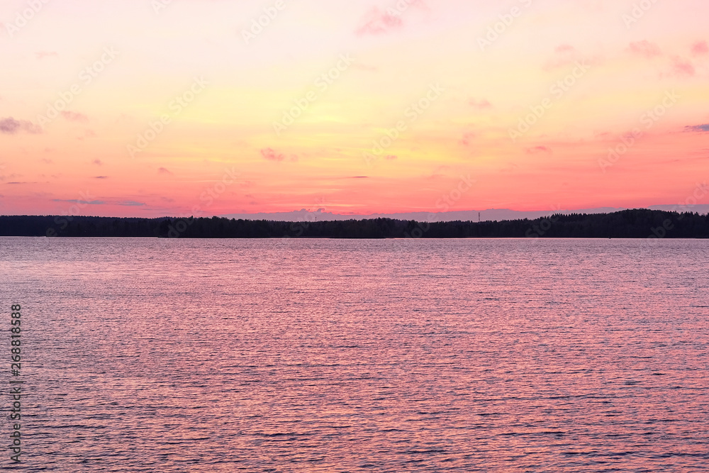 landscape with the image of the sunset over the lake Valdai