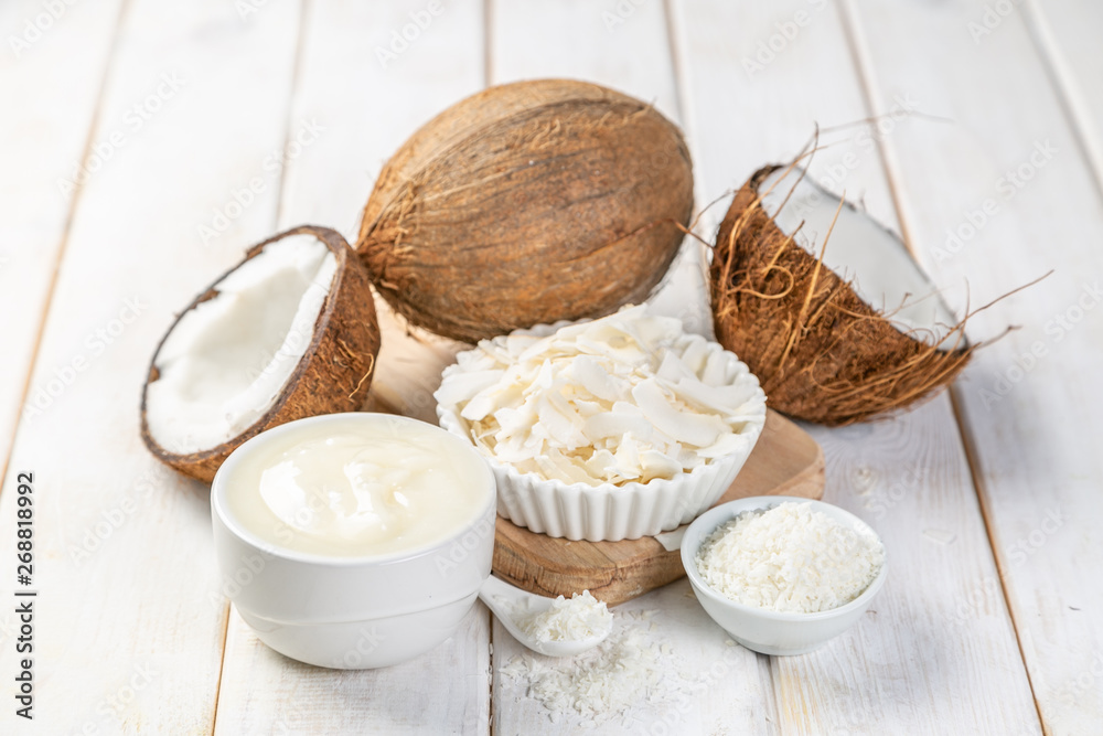 Wellness concept - coconut oil and ingredients on wood background, copy space Wellness concept - coconut oil and ingredients on wood background, copy space
