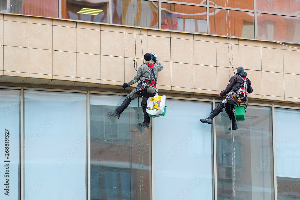 Moscow, Russia - May, 2, 2019: Steeplejacks Work on a Wall in Moscow