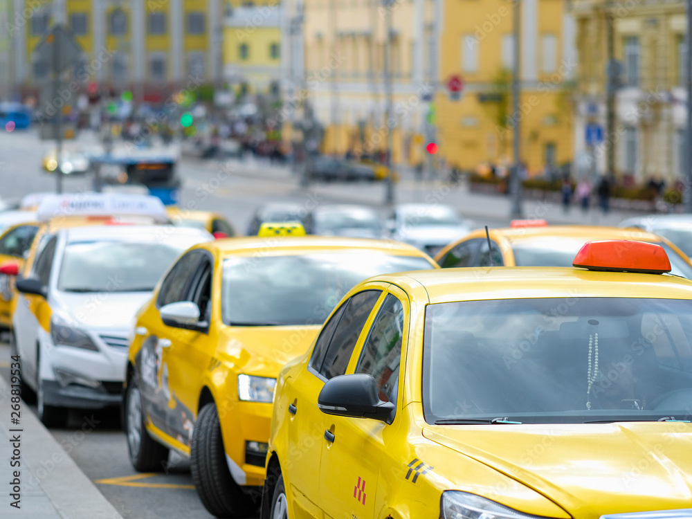 Moscow, Russia - May, 6, 2019: taxi in a center of Moscow, Russia Moscow, Russia - May, 6, 2019: taxi in a center of Moscow, Russia