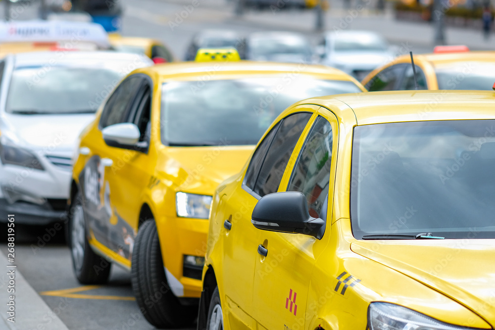 Moscow, Russia - May, 6, 2019: taxi in a center of Moscow, Russia Moscow, Russia - May, 6, 2019: taxi in a center of Moscow, Russia