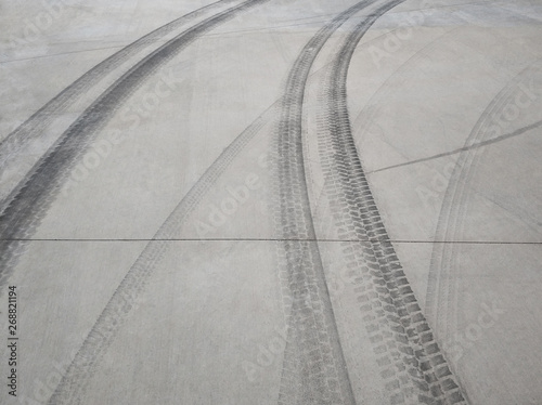 Tire track on concrete flooring background