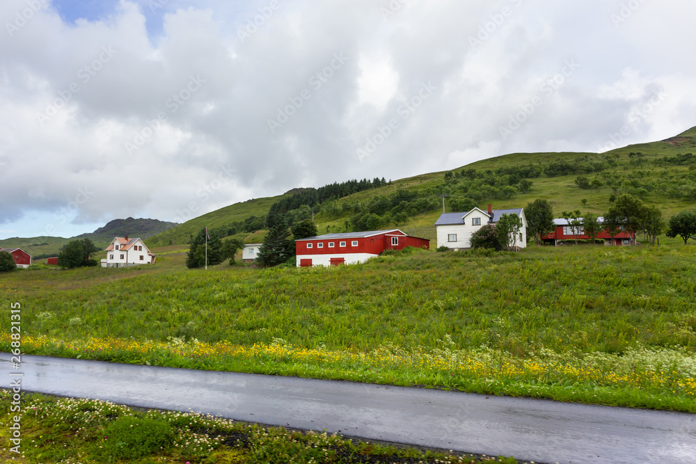 Beautiful scandinavian landscape with meadows, mountains and village. Lofoten islands, Norway. Beautiful scandinavian landscape with meadows, mountains and village. Lofoten islands, Norway.