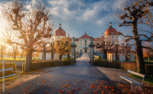 Incredible sunny morning. Famouse Moritzburg Castle near Dresden under golden misty glow when the sun rises. Amazing Picturesque Scene. Creative image. top Germany travel locations. Saxony, Germany photo