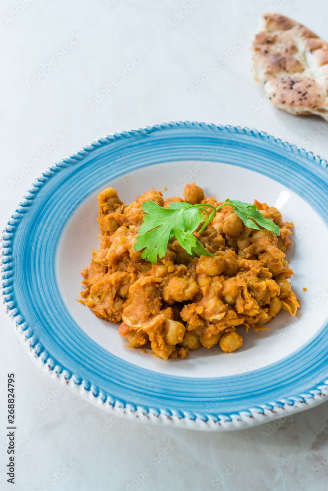 Chole or Chana Masala or Spicy Chickpeas is traditional North Indian main course recipe and usually served with Bhature or Roti/ Naan. Chole or Chana Masala or Spicy Chickpeas is traditional North Indian main course recipe and usually served with Bhature or Roti/ Naan.