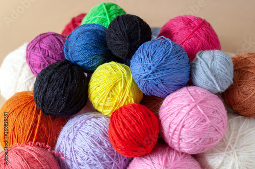 A bunch of colorful yarn balls.