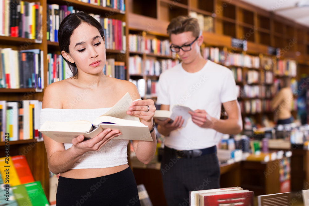 Modern girl reading interesting book