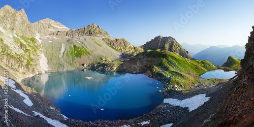 Fototapeta Naklejka Na Ścianę i Meble -  Scenic mountain landscape. Lakes in the Caucasus Mountains, Arkhyz. Beautiful water color, snow and blue sky.