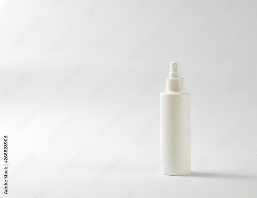 White plastic spray bottle isolated on white White plastic spray bottle isolated on white